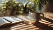 © Dabo - Sunlight streams onto a wooden table, illuminating a ceramic mug and an open notebook