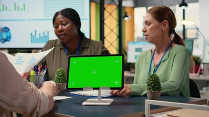 Poster - Corporate women gather with a chroma key display in modern work environment, evaluating financial data, strategic indicators and other information during the boardroom meeting. Camera B.