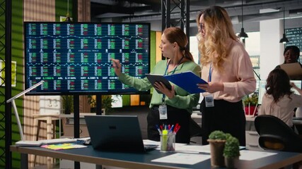 Poster - Ambitious group of multiethnic women collaborating in a modern office, discussing progress indicators, sharing insights and setting the foundation for a corporate success story. Camera A.