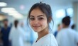 © Arvind Shiv - Young female nursing student working alongside a team of medical students and doctors. Junior doctor portrait during medical internship, highlighting diversity in healthcare teams, Generative AI