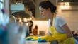© mohdfadzil - Cleaning Lady Spraying Disinfectant on Kitchen Counter – Safe and Hygienic Home Cleaning