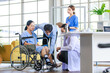 © Bangkok Click Studio - Asian doctor physiotherapy check splint leg support to senior old woman patient assisted by caregiver and nurse medical orthopedic trauma treatment team providing rehabilitation in a healthcare clinic