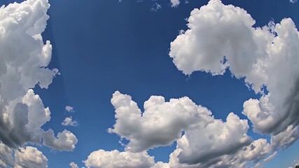 Wall Mural - beautiful 4k timelapse of white cumulus clouds drifting through a crystal clear blue sky forming a serene cloudscape that makes an ideal nature inspired background for peaceful visual storytelling
