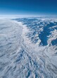 © Marewa - High-angle view of snowy mountain range with valley