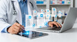 © designartwork28 - Doctor reviewing digital medical records on a tablet and laptop, representing modern healthcare technology and patient data management