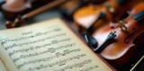 Close-up of musical score, woodwind and string instruments subtly blurred in background, concert, score, classical