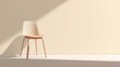 © Muhammad Wasil - A lightwood chair stands against a cream wall bathed in natural light casting strong shadows