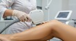 © Letcia - Close-up of technician performing laser hair removal on a woman's leg using a professional device in a clean, clinical setting ,ideal for beauty, skincare, and aesthetic treatment themes.