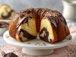 © Wandrian - Sliced Chocolate Swirl Bundt Cake on Stand