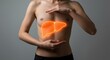 © Iurii - Illustration of a glowing liver on a human torso for health awareness