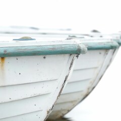 Wall Mural - a close-up shot of a small wooden rowboat sitting peacefully on a sandy beach