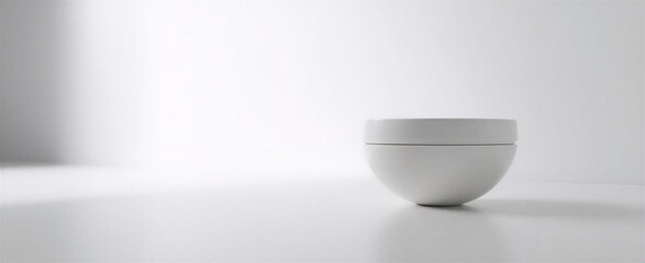 Smooth white surface, clean composition, with a single soft box light setup in the background to the left, providing even diffused lighting. Clean background behind the product, with subtle highlights