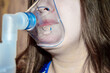 © Виталина Митрофанова - a person using a nebulizer mask healthcare and medical services respiratory care asthma treatment for lung-related nebulizers or oxygen therapy equipment respiratory diseases proper usage of inhalers