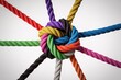 © Ajay - Colourful ropes tied in knot unity teamwork connection collaboration strength diversity abstract concept.