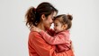 © Aimstock - A woman with brown hair, who is smiling as she hugs a young child. They are both dressed in casual attire, suggesting a relaxed, possibly family moment