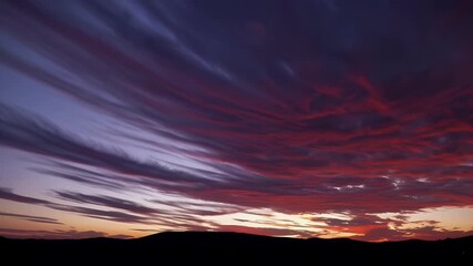 Wall Mural - Breathtaking 4K time lapse sunset skies glowing rich orange pink tones dramatic clouds roll slowly overhead perfect conveying awe reflection cinematic natural