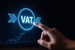 © Gibster - Tax impact trade. Hand pointing at a digital VAT icon on a screen with a financial graph in the background.