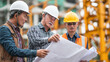 © lungkeemao - Engineer checking blueprint with construction crew at project site.