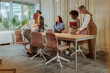 © bernardbodo - Businesswomen about to sit and have a meeting inside of the glass office