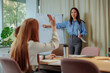 © bernardbodo - Businesswoman asking a question during a presentation