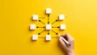 © Nashihal - Hand drawing a business process flow chart on a yellow surface