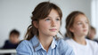 © Denis Yevtekhov - Engaged Schoolgirls in a Classroom Setting