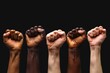 © SANAULLAH - A row of raised fists in different skin tones, symbolizing unity and diversity against a black background. A concept for Black History Month.