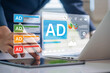 © IDOL'foto - online advertising campaigns interface management. businessman analyzing digital advertising dashboard on tablet and laptop, data strategy for content marketing, targeting, and performance