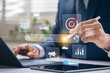 © IDOL'foto - Search marketing and keywords optimization concept with businessman using stylus on digital interface showing SEO, targeting, and advertising icons for AI online campaign and data driven visibility