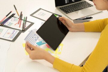Wall Mural - Creative web designer planning UI application and developing digital template