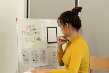 Wall Mural - Creative web designer planning UI application and developing digital template