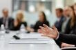 © Poj - Close-up of hand gesturing during business meeting in conference room