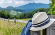 © thodonal - Stylish hat and denim jacket resting on a fence post