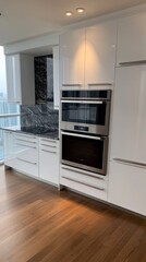 Poster - A contemporary kitchen showcases elegant cabinets, a dark marble backsplash, and large windows offering a view of greenery and skyline