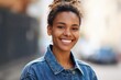 © Maria - Cheerful young woman with curly hair smiles confidently, wearing