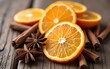 © wu - Dried Orange Slices Cloves and Star Anise on Rustic Wooden Background. High quality
