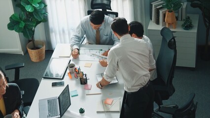 Poster - Top down view of skilled engineer team compare between blueprint and house plan. Aerial view of group of architect or designer discussing and point note to brainstorm about blueprint. Alimentation.