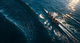 Team of four rowers in sync powering a racing shell through calm blue water, an aerial view of synchronized athletic effort.