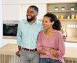 © Lumos sp - Portrait of a lovely young couple  together in kitchen at new home