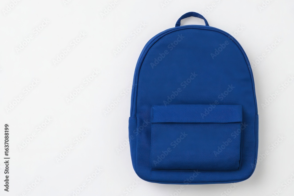A solid blue backpack is displayed against a clean white background. The backpack features a simple design with a front pocket and a single top handle for carrying.