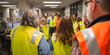 © Daniel - Individuals in Emergency Manager vests participate in a fire drill, demonstrating the vital role of emergency management. The Emergency Manager vests highlight safety and preparedness in the drill.