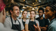 © akridiy - Restaurant staff listening to manager during team briefing