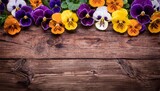 vibrant pansies border on weathered wood