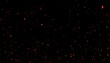 © IKetut - Fiery embers and glowing sparks floating up from a large blaze against a dark black background, creating a dynamic particle effect.
