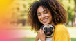 © Milan - Happy young black woman hugging a pug dog outdoors. Smiling african american girl with eyes closed embracing her pet.