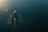 Two synchronized rowers glide across calm water in perfect aerial symmetry