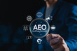 © Supatman - AEO Answer Engine Optimization Strategy Concept. Businessman holding magnifying glass with AEO icons, representing artificial intelligence, chatbots, search optimization, and marketing strategy.