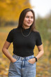 © shymar27 - Portrait of a young beautiful dark-haired girl in an autumn park.