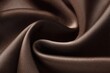 © Akhir - Close-up of rich brown satin fabric with flowing curves
