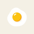 © damar - A single fried egg with a bright yellow yolk on a light background.